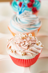 Pink cupcake decorated with pearl beads