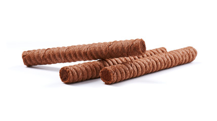 Chocolate wafer rolls with butter and cocoa filling on a white background