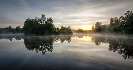 Fototapeta na wymiar Summer sunrise over Swedish lake