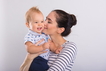 Beautiful young mom with baby .