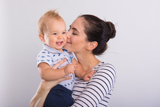 Beautiful young mom with baby .