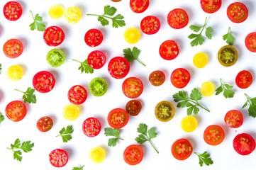 Sliced cherry tomatoes with parsley background