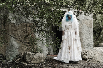 scary evil clown in a bride dress