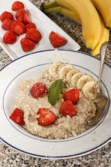 warm porridge, scottish breakfast with strawberryand banana