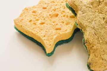 Old and new sponges for household cleaning of kitchen and bathroom