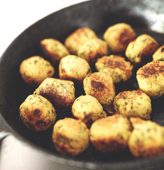 Fried falafel in a cast-iron pan close up. Middle eastern dish falafel pan
