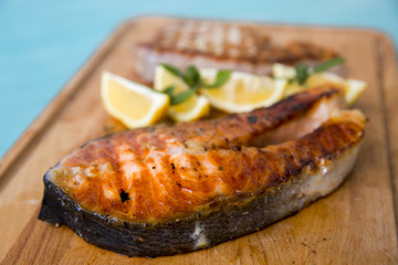tuna and salmon on a wooden board