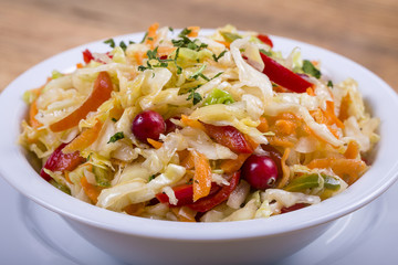Ukrainian and Russian dishes - homemade marinated, sour cabbage with carrots and onions, close up