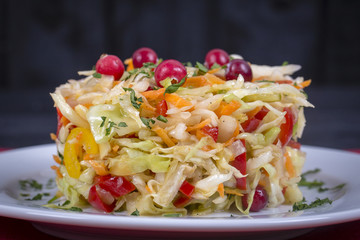 Ukrainian and Russian dishes - homemade marinated, sour cabbage with carrots and onions, close up