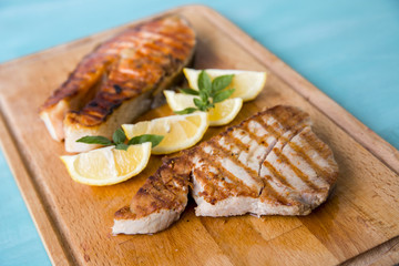 tuna and salmon on a wooden board