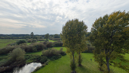 A local park in late September, daytime with lush foliage