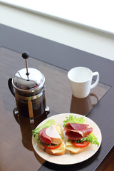 Breakfast with sandwich and coffee