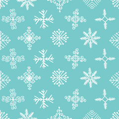 Fototapeta na wymiar Hand drawn winter seamless patterns with snowflakes