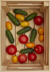 Assortment of fresh  vegetables in a wooden box