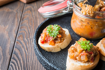 Bread toasts with eggplant caviar.