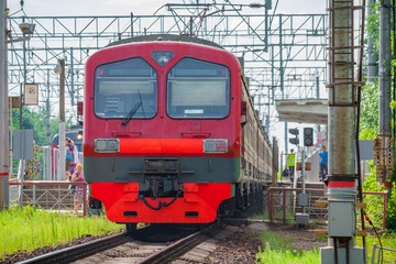 Obraz premium Passenger electric train arrives at the station