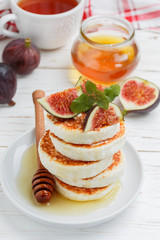 Homemade cheese pancakes with honey and fresh raspberries. Traditional Tasty and healthy Breakfast. Selective focus