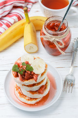 Homemade cheese pancakes with honey and fresh raspberries. Traditional Tasty and healthy Breakfast. Selective focus