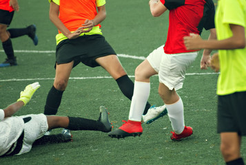 Fototapeta premium Unrecognizable players on the football field. Training.