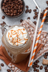 Chocolate frappe coffee with marshmallows and syrup in a Mason jar . Selective focus