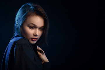 Fototapeta premium beautiful young sad woman in blouse at black background with copy space