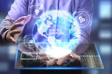 The concept of business, technology, the Internet and the network. A young entrepreneur working on a virtual screen of the future and sees the inscription: Digital banking