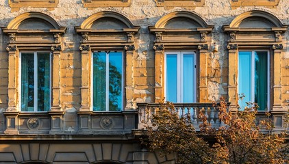 Row of window on an old building with dilapidated or damaged facade in Zagreb, Croatia
