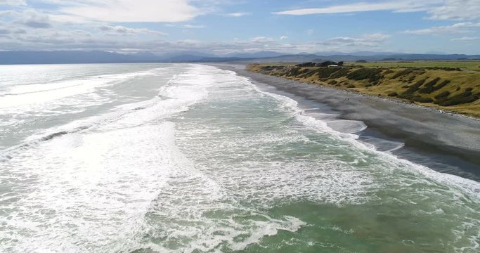 New Zealand aerial drone video of beach and ocean landscape Te Waewae Bay coast at McCracken's Rest in the Southland region of the south island of New Zealand