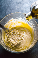 Beating of homemade mayonnaise with olive oil