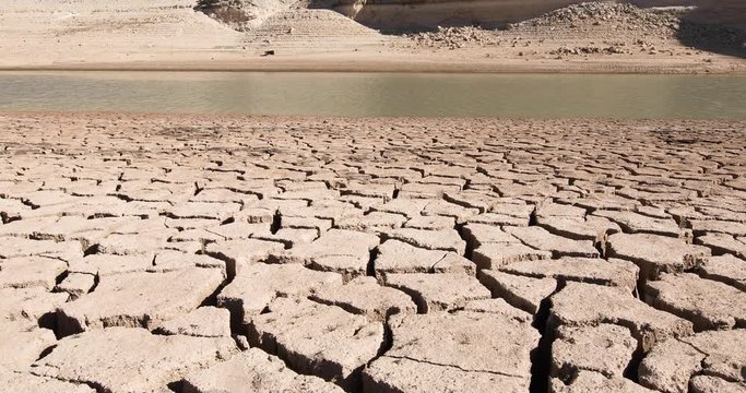 4K video. Landscape of dry earth ground and river with water, in Entrepenas reservoir, in Guadalajara, Castilla, Spain Europe

