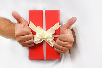 gift in the hands of a man on a white background