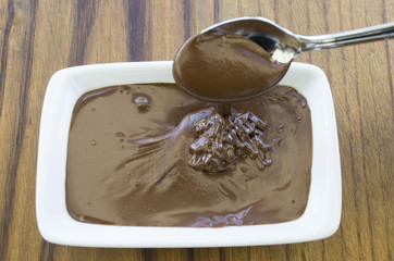 melted chocolate on wooden table