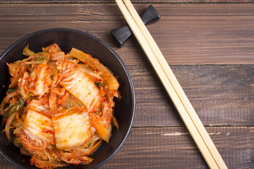 Kimchi or kimchee on black plate