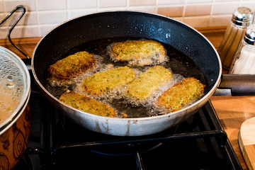 Frying Falafel in a pan.