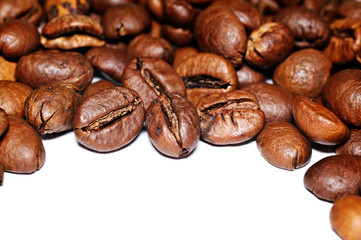 Coffee Grains fried on a white background. Macro