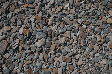 Beautiful flat stones on the seashore. Gorgeous background