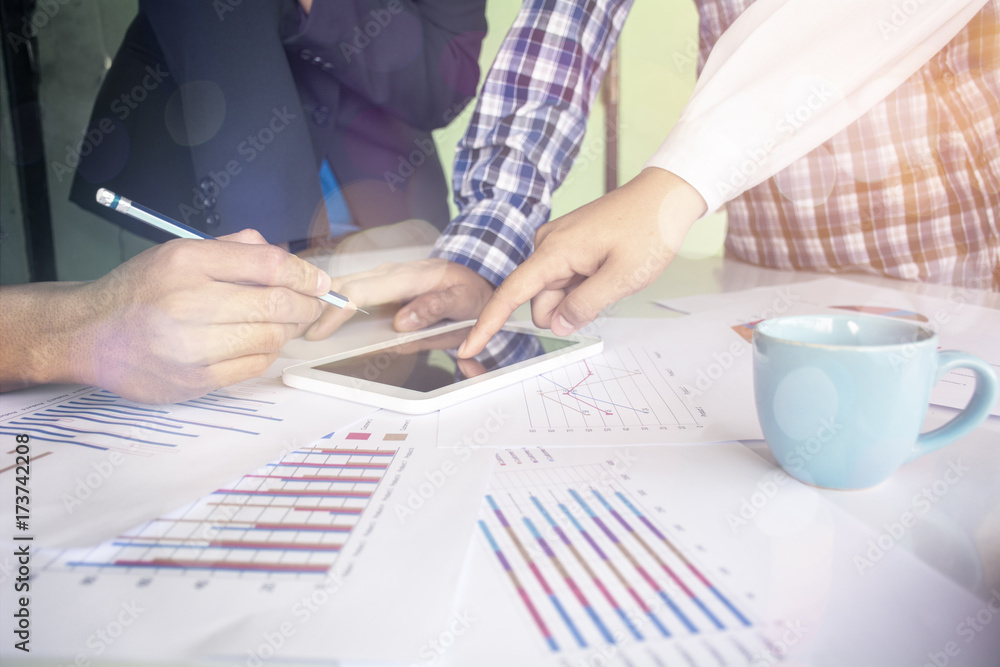 Poster business team two colleagues discussing financial graph data on office table.business team two colle