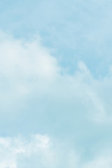 The blue backdrop has some clouds.