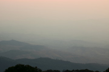 Beautiful twilight layers of silhouettes mountain in Chiang Mai , Thailand