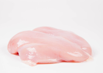  Raw chicken breast on a white background