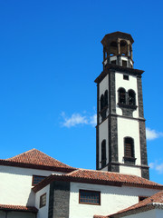 Fototapeta premium the old church in santa cruz tenerife with bell tower and blue sky
