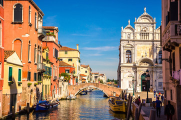 Obraz na płótnie Canvas Traditional narrow canal with gondolas in Venice, Italy
