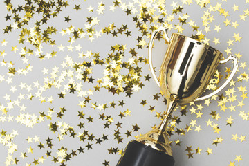 Gold winners trophy with golden shiny stars