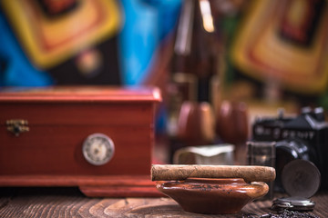 Wooden humidor, cigars and ashtray
