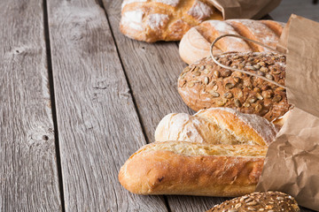 Bread background on rustic wood