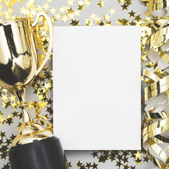 Gold winners trophy with a blank poster label and golden shiny stars