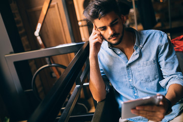 Portrait of young handsome man in blue shirt