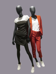 Two full-length female mannequins.