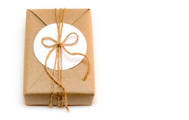 Gift box wrapped in kraft paper and rustic hemp as natural rustic style