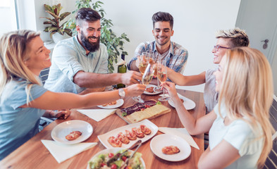 Friends having lunch at home